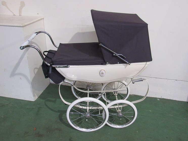 A Silver Cross dolls pram with canopy,