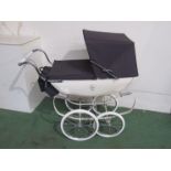 A Silver Cross dolls pram with canopy,