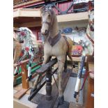 A 19th Century hide covered rocking horse on trestle rocker,