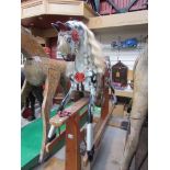 A Collinson wooden painted dapple rocking horse on trestle rocker, needs some minor restoration,