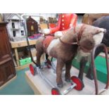 An early 20th Century "Panurge" sit on/push along toy horse with rise and fall mechanism