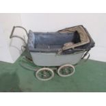 A 1920's wooden bodied grey sprung dolls pram,