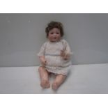 A bisque head, composition body girl doll, 39cms, head stamped Armand Marseille 971 Germany A3M,