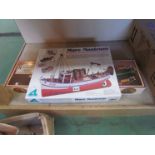Two boxed unmade wooden model kits,