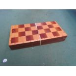 A 1960's Russian stacking wooden toy together with a vintage Russian chess set and doll,