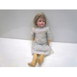 A bisque head, composition body girl doll, 52cms,