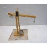 A wooden construction toy crane