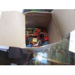 A box containing painted Warcraft figures,