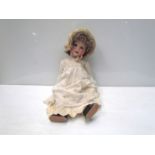 A bisque head, composition body girl doll, 54cms,