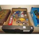 A box of mixed diecasts including Timpo and Corgi and a pair of rollerskates