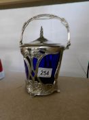 An art nouveau silver plated biscuit/ice barrel with blue glass liner, circa 1906.