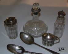 A silver rimmed miniature ship's decanter, 2 silver topped bottles,