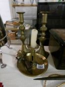 A pair of brass candlesticks,