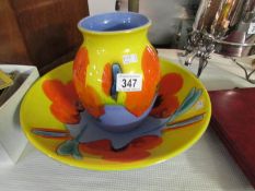 A matching Poole pottery poppy design vase and bowl