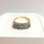 A tanzanite 5 stone ring in gold,