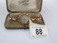 A Victorian 9ct rose gold ladies wrist watch by James Walker of London, in working order,
