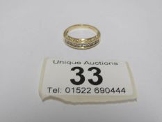 An 18ct gold ring set 9 diamonds,