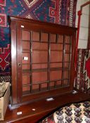 A mahogany wall cabinet