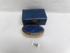 A gentleman's silver dressing brush in case