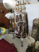 A unusually shaped silver plated tea urn