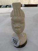 A 19th century carved ivory African female head