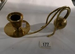 A brass ball counter balance candlestick in the style of Benson (unsigned)