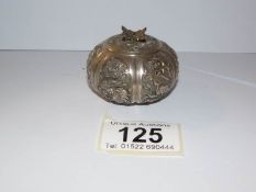 A white metal Chinese pill box,