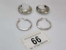 2 pairs of silver earrings,