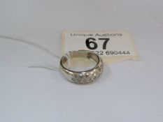 An 18ct gold diamond band ring set with 18 diamonds,