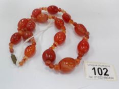 A Victorian amber bead necklace