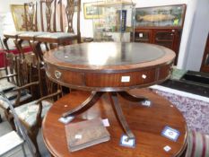 A mahogany drum table