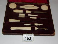 A cased 1920's French ivory handled manicure set