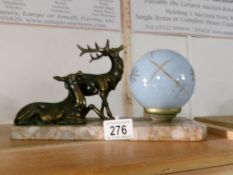 A French table lamp with marble base and surmounted deer