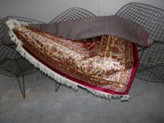 A red ground Keshan rug,