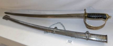 An officer's cavalry sword with pierced brass hilt and complete with scabbard