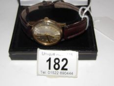 A 9ct gold gent's wristwatch by Garrard