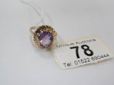 A circa 1970's amethyst set ring in 9ct textured gold (total weight 5.