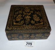 A lacquered and gilt jewellery box