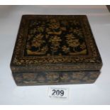 A lacquered and gilt jewellery box