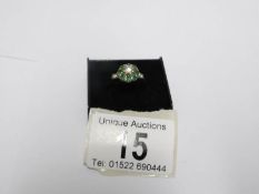 An 18ct yellow gold diamond and emerald ring,