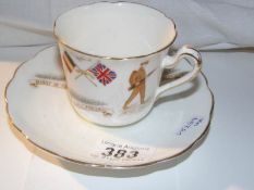 A WW1 commemorative cup and saucer inscribed 'Might in the right cause shall prevail,