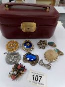 A jewellery case containing assorted vintage costume jewellery