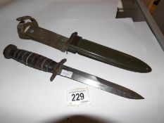 An American commando knife in sheath