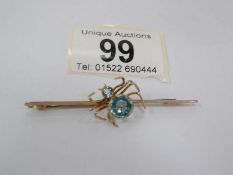 A 9ct gold spider brooch with aquamarine stones