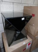 A new and unused glass coffee table