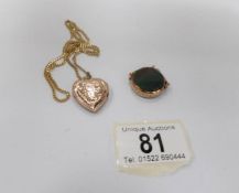 A Victorian fob set with bloodstone in 9ct rose gold together with a gold heart locket