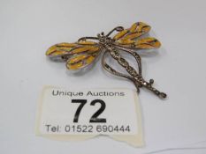 An enamelled and silver dragon fly brooch,