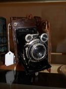 A vintage Zeiss Ikon camera in leather case