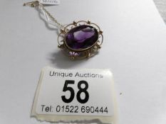 A Victorian gold brooch set amethyst