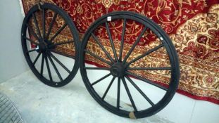 A pair of antique trap wheels